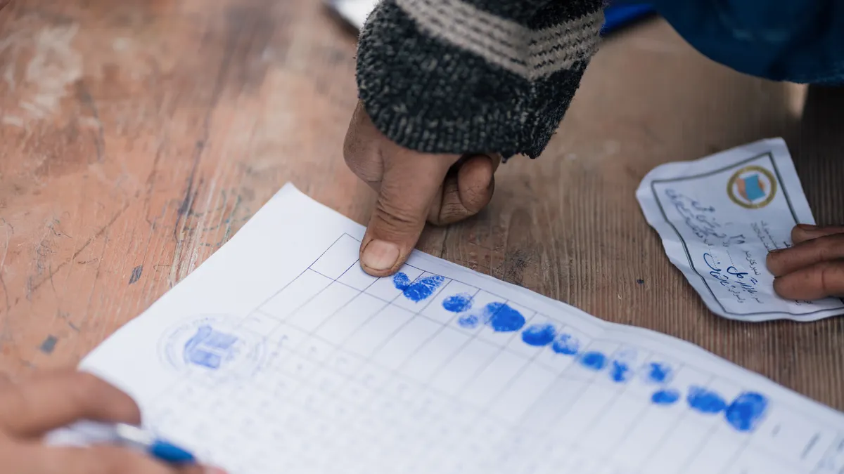 Fingerprints being taken on a form