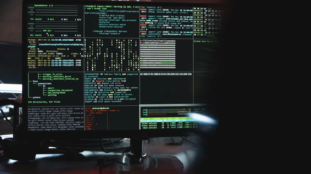 How to Track U.S. Cybersecurity Breaches in the Tech Sector computer monitor filled with code and terminal windows