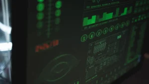 monitor showing green cybersecurity-style dashboards and data