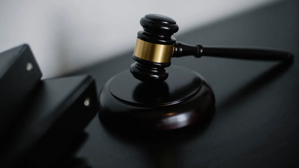 How U.S. Tech Antitrust Cases Affect Big Tech Companies Judge's gavel on a black stand beside folders