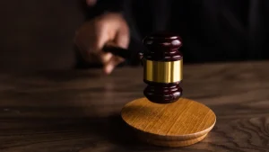 Judge's gavel on a wooden stand